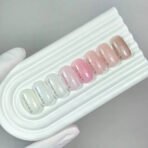 NAILSOFTHEDAY Cover Base NEW Milk 06 – półprzezroczysta mleczna baza z niebieskim brokatem, 10 ml - obrazek 2